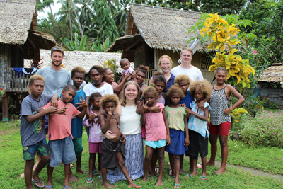 Urban planning student Kate and a group of young children she worked with while volunteering in the Solomon Islands