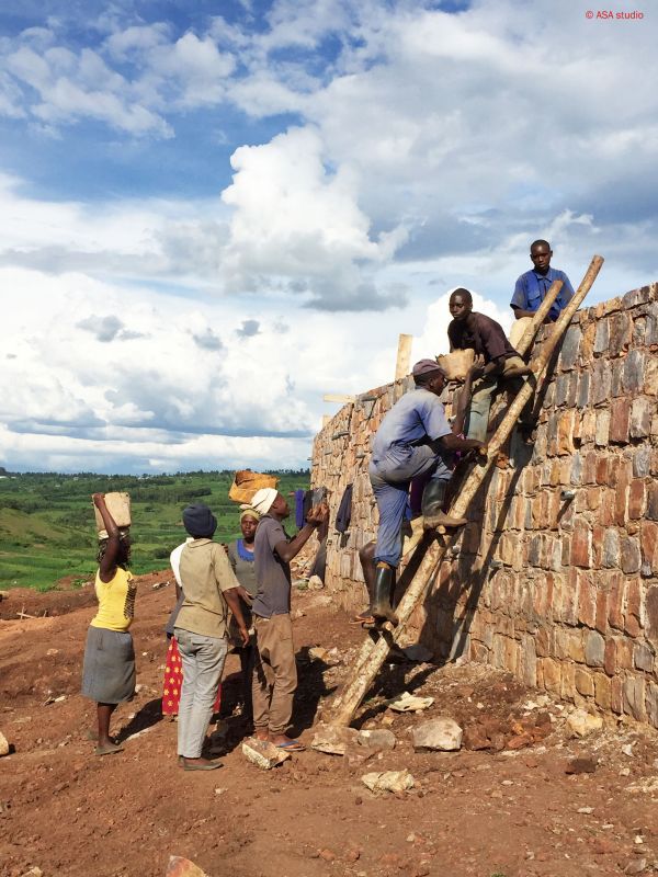 people building a retaining wall in Rwanda 