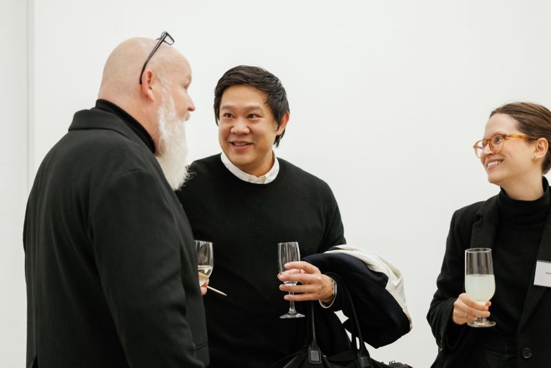 Guests at a 2024 donor event with champagne glasses