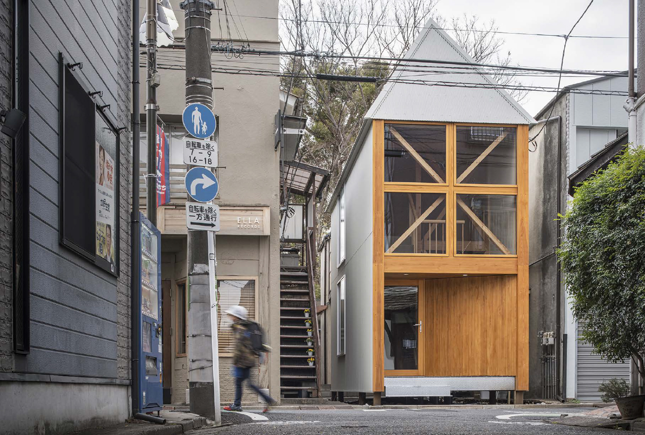 Image of a glass and wood house in a Japanese street
