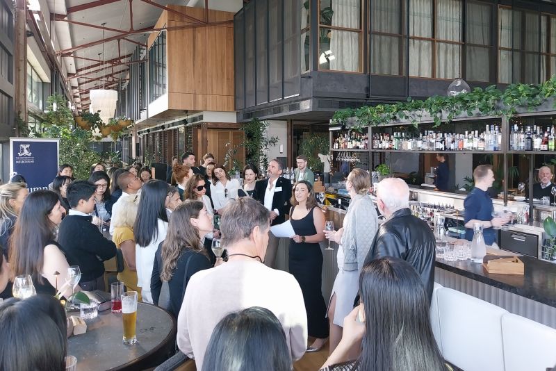 A crowd of people at a bar