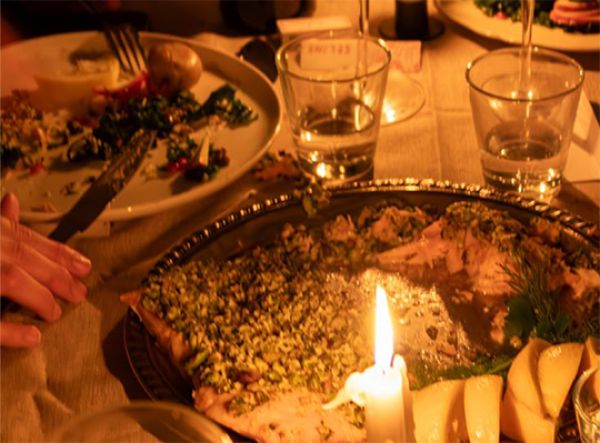 A photo of a candlelit dinner table