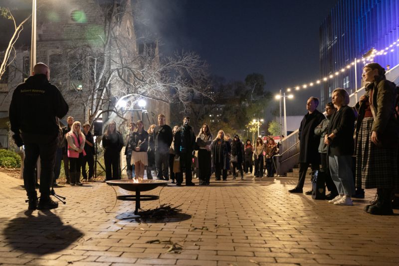 People outside for a smoking ceremony
