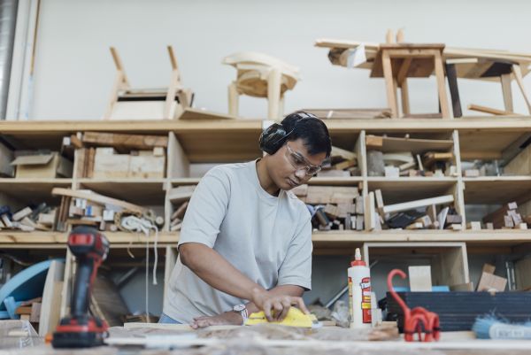 Student in wood workshop Student in wood workshop