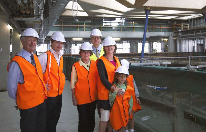 Image shows [left to right] Peter Hansen, Richard Hansen, Neroli Hansen, Dean Tom Kvan, Louise Hansen and her two daughters, touring the construction site in March 2014.