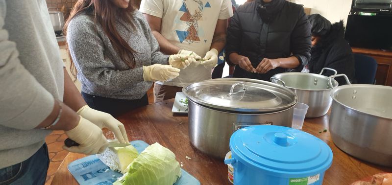 people cooking at a community house in Melbourne