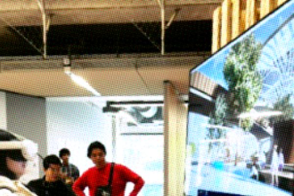 A person watching a screen with VR googles on.