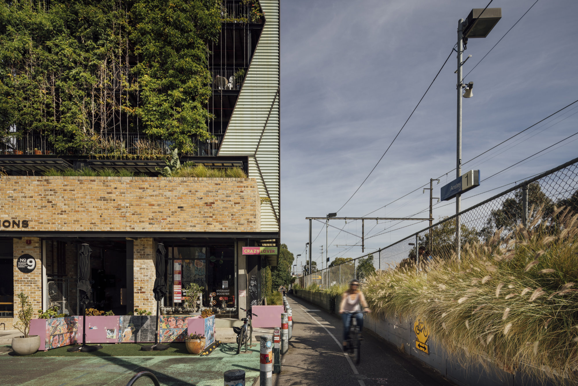 A new apartment building next to a bike path