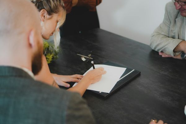A group of people collaborate around a table