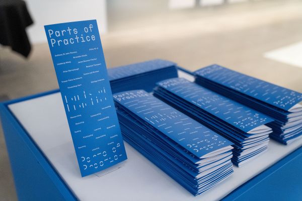 Image of Parts of Practice, blue catalogues from launch event.