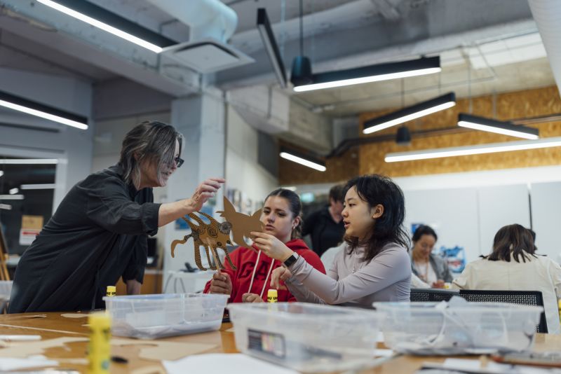 A photograph of school students in a workshop