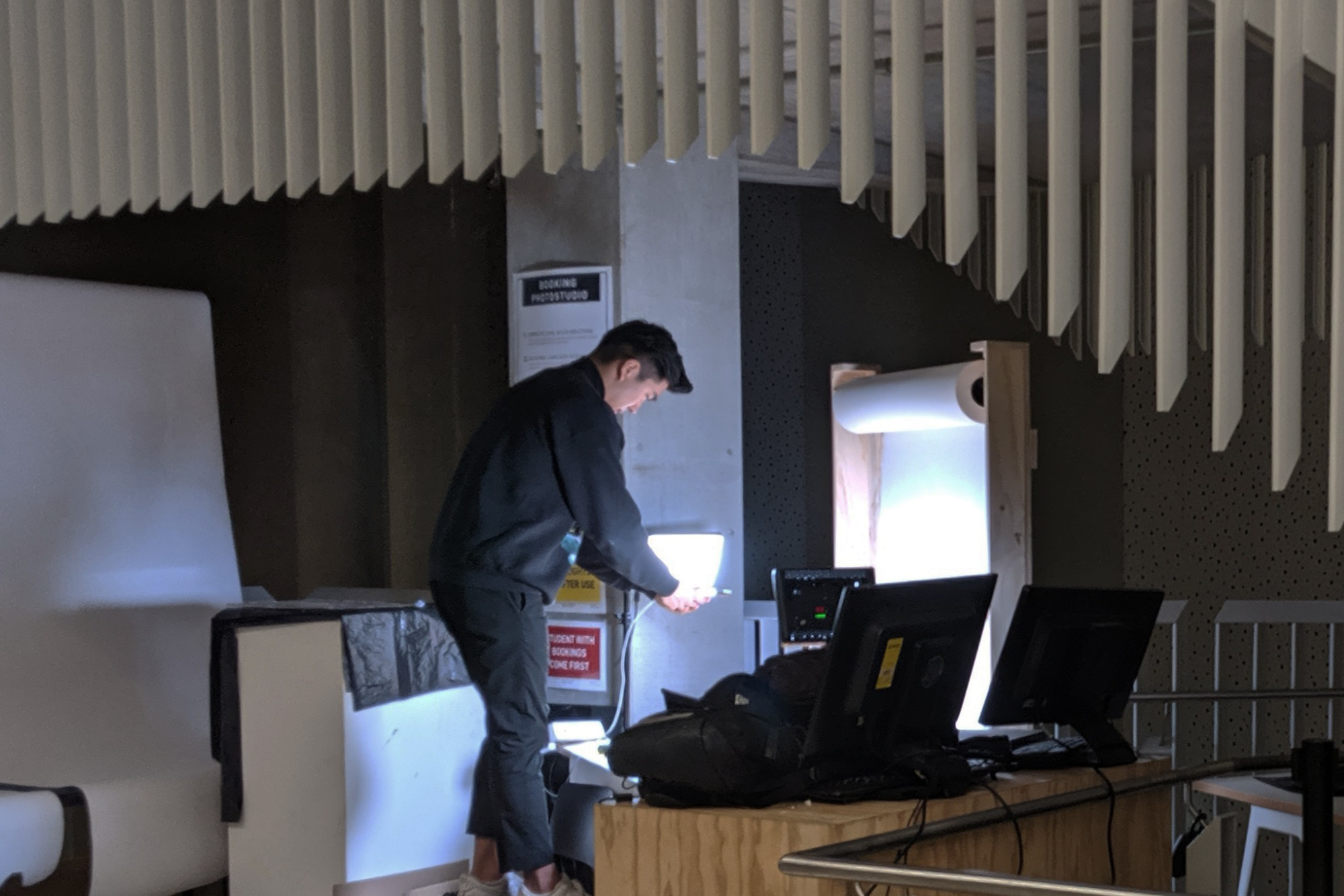 A person setting up a mobile photo studio