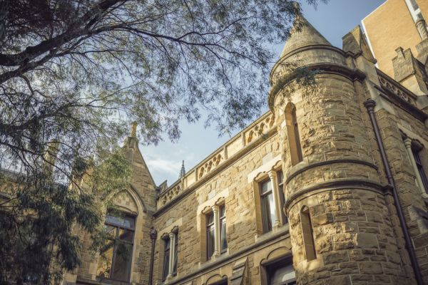 External view of a university building with a turret