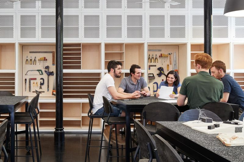 Students around a table in a workshop