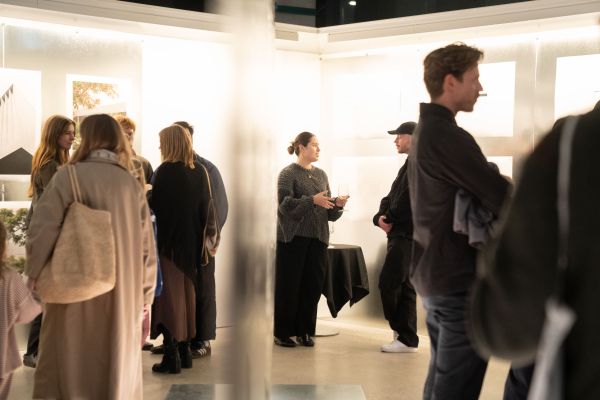 Guests talking and looking at works at Parts of Practice exhibition opening.